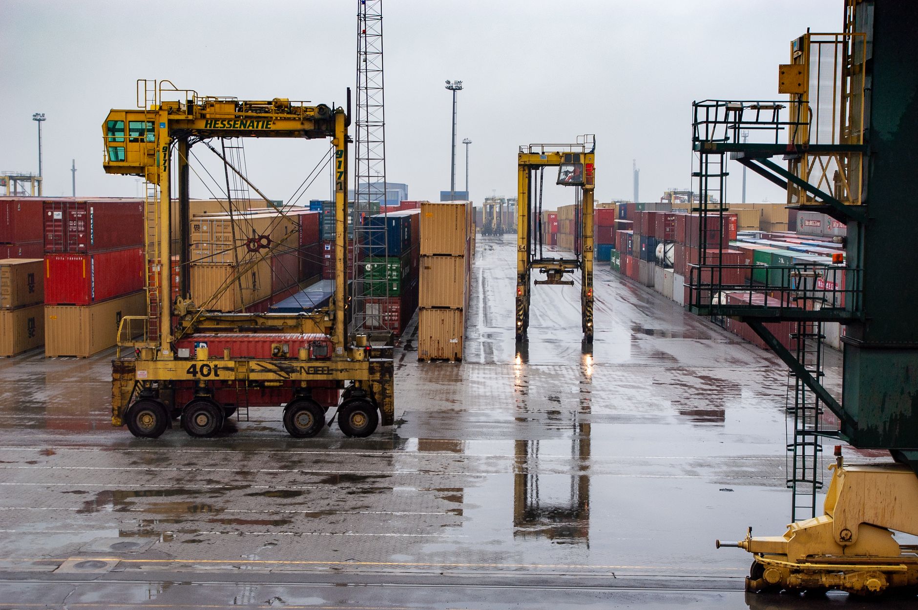 A large sea port with massive container cargo logistics structures