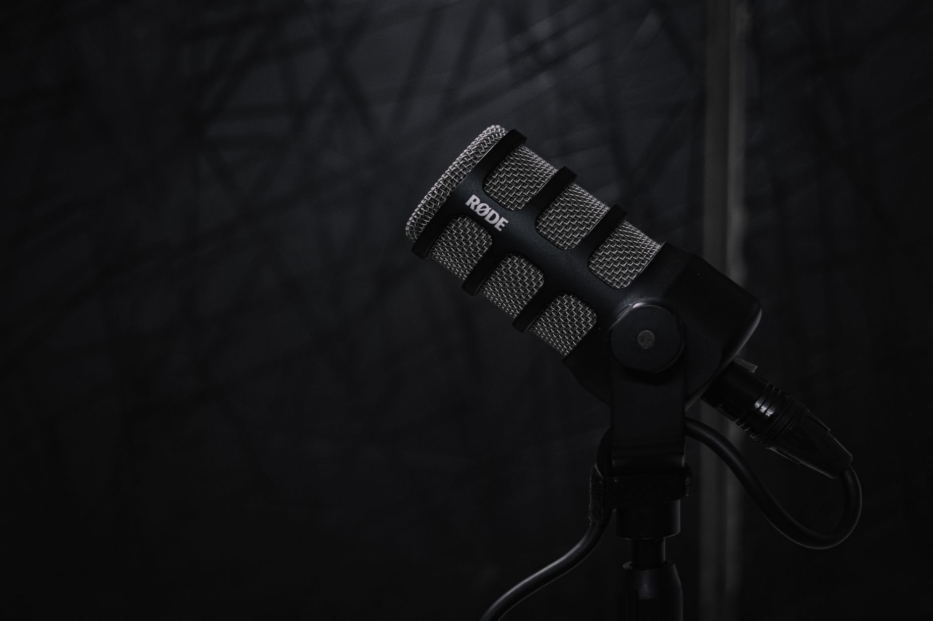 Close-up broadcast microphone inside an editorial agency studio