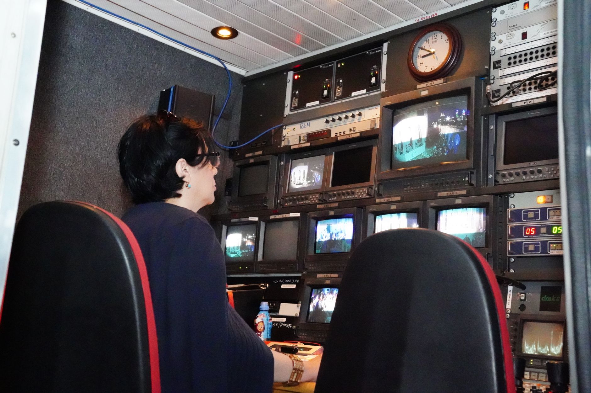 Broadcast controls inside a high-tech media studio environment
